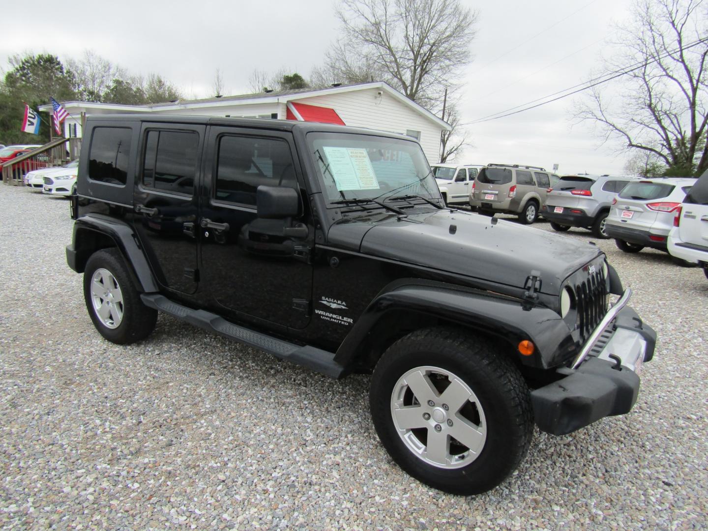 2008 Black Jeep Wrangler Unlimited Sahara 4WD (1J4GA591X8L) with an 3.8L V6 OHV 12V engine, Automatic transmission, located at 15016 S Hwy 231, Midland City, AL, 36350, (334) 983-3001, 31.306210, -85.495277 - Photo#0